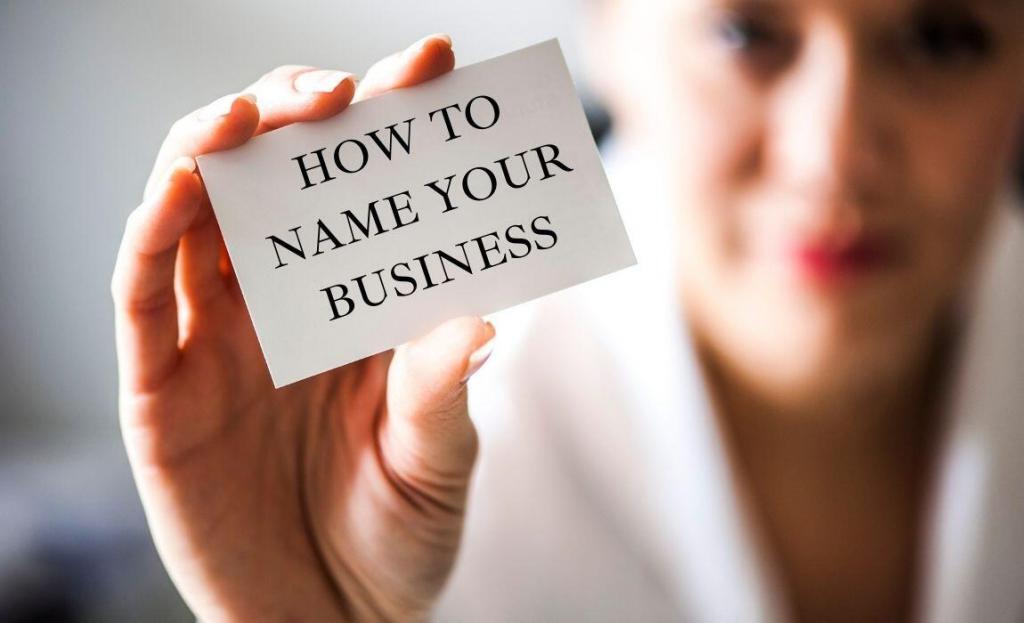 woman holding a business card that says "how to name your business"