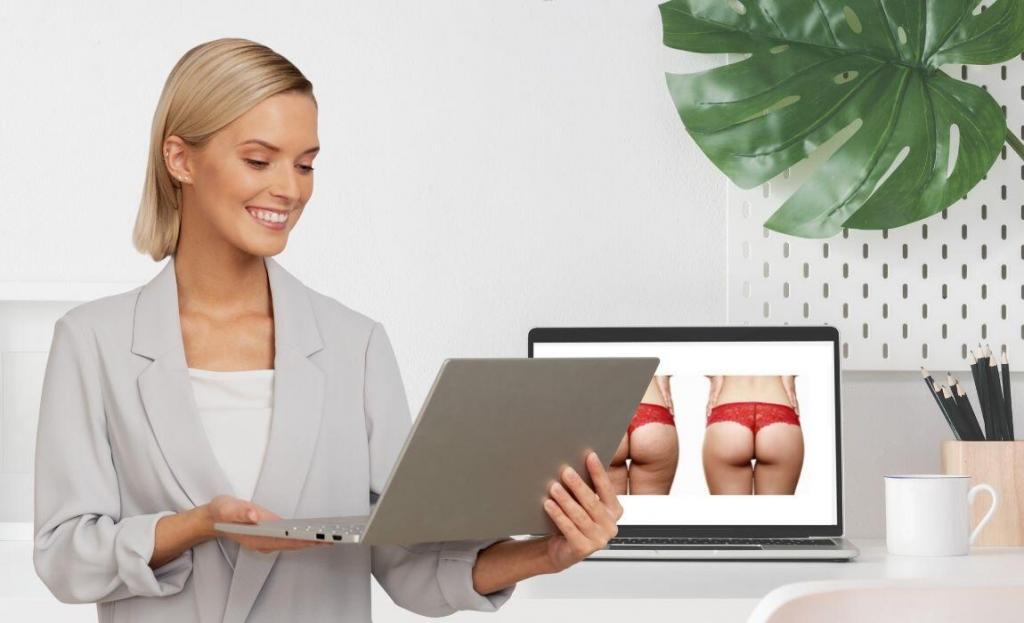 blonde woman smiling holding a laptop in front of a desk with an laptop displaying before and after photos of a woman's body contouring treatment