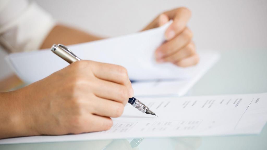 hands filling out paperwork for contouring consultation