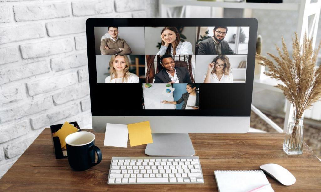 computer monitor with faces on the screen on a video conference business coaching call