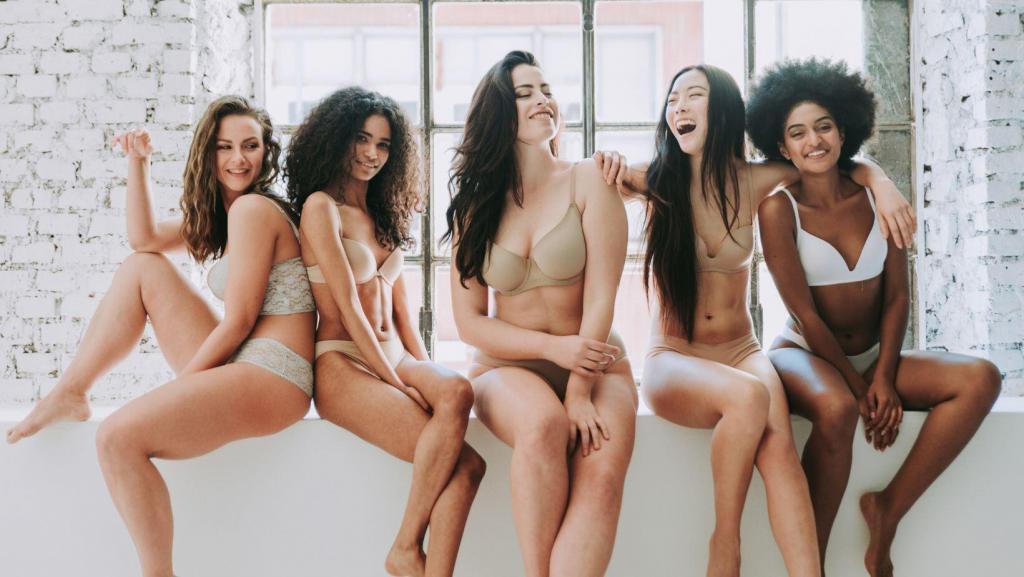 divers young women smiling and laughing in bra and panties