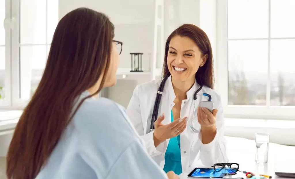 female medical professional building rapport with patient to convert more consultations