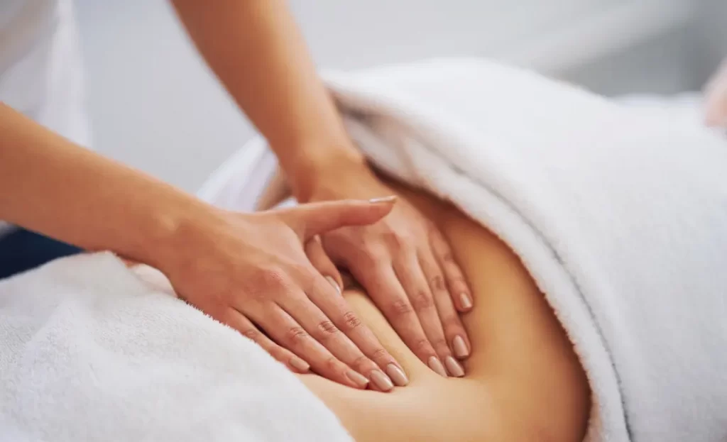 woman receivingCryolipolysis post-treatment massage