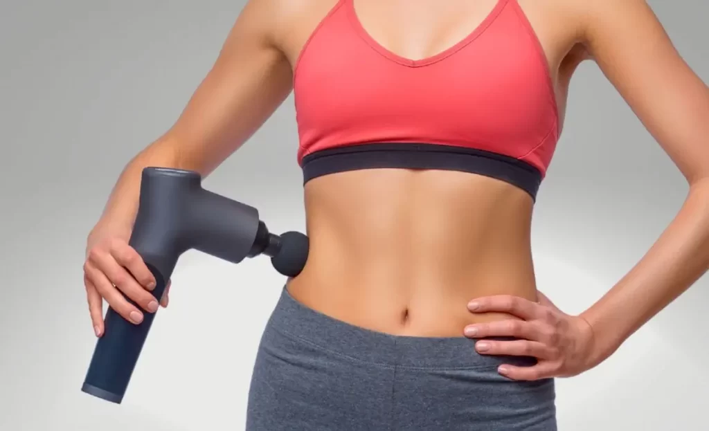 woman using massage gun leads to quicker fat loss