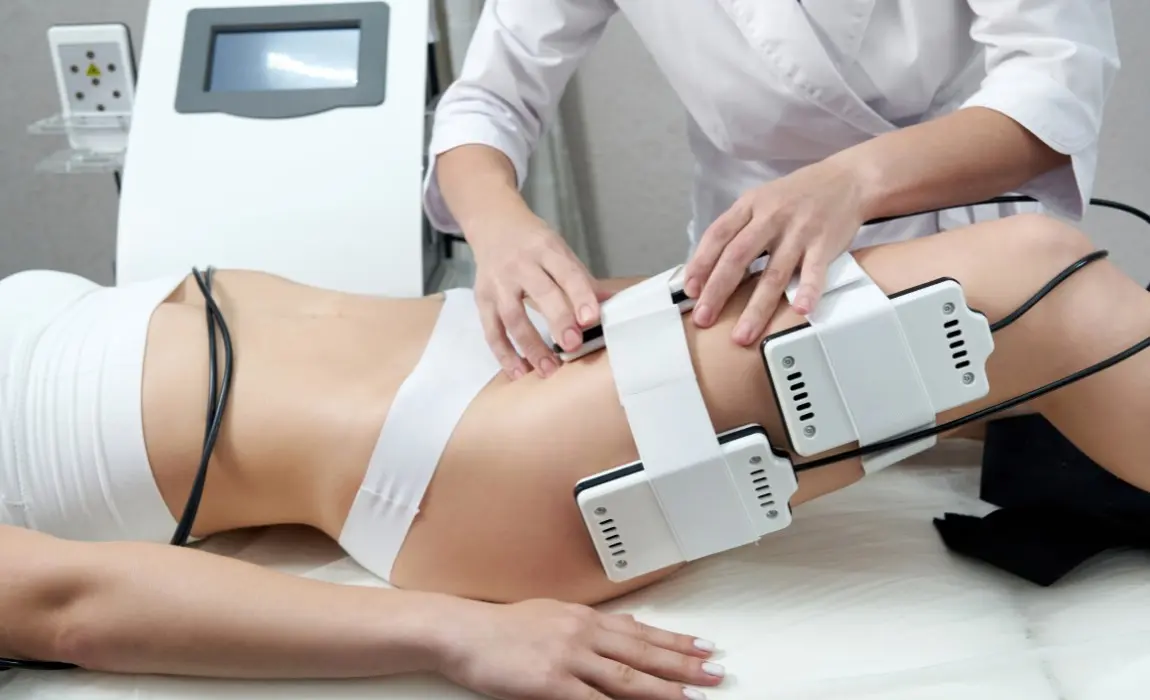 lipo laser treatment Esthetician certified in lipo laser setting up treatment on a client