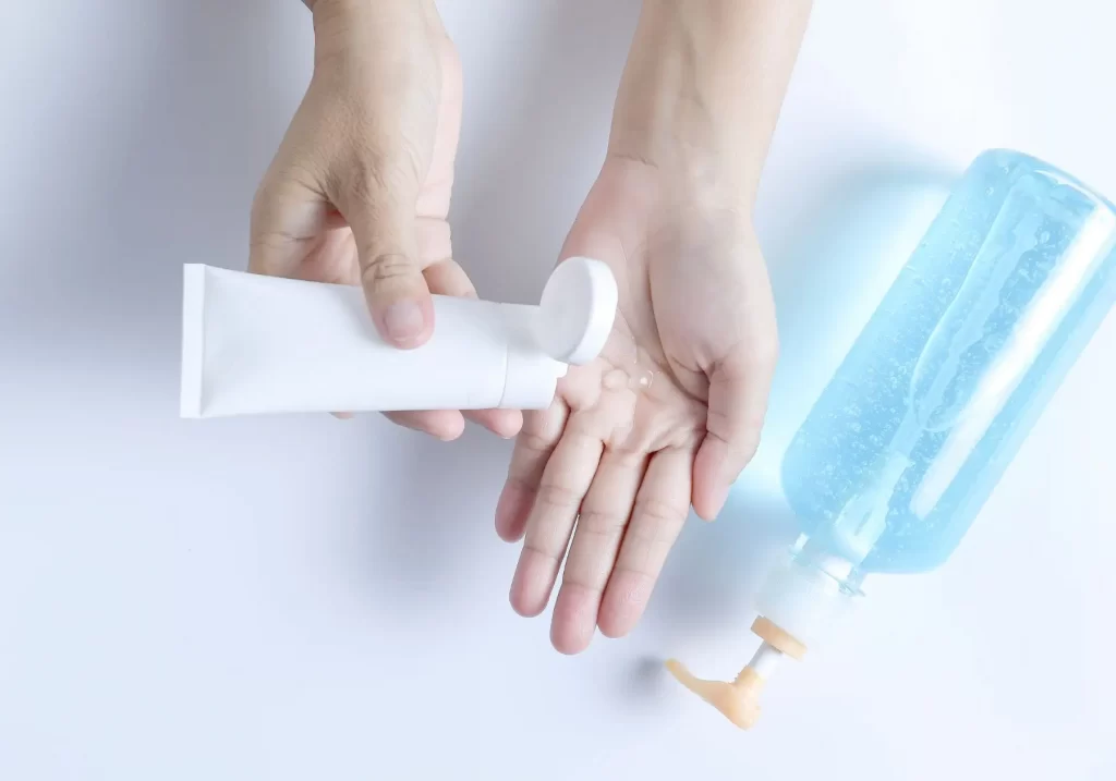 hand holding tube trying conductive gel options for radiofrequency